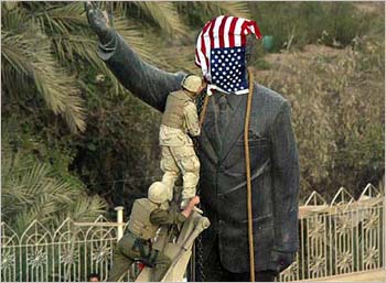 /archives/Saddam_status_and_us_flag.jpg
